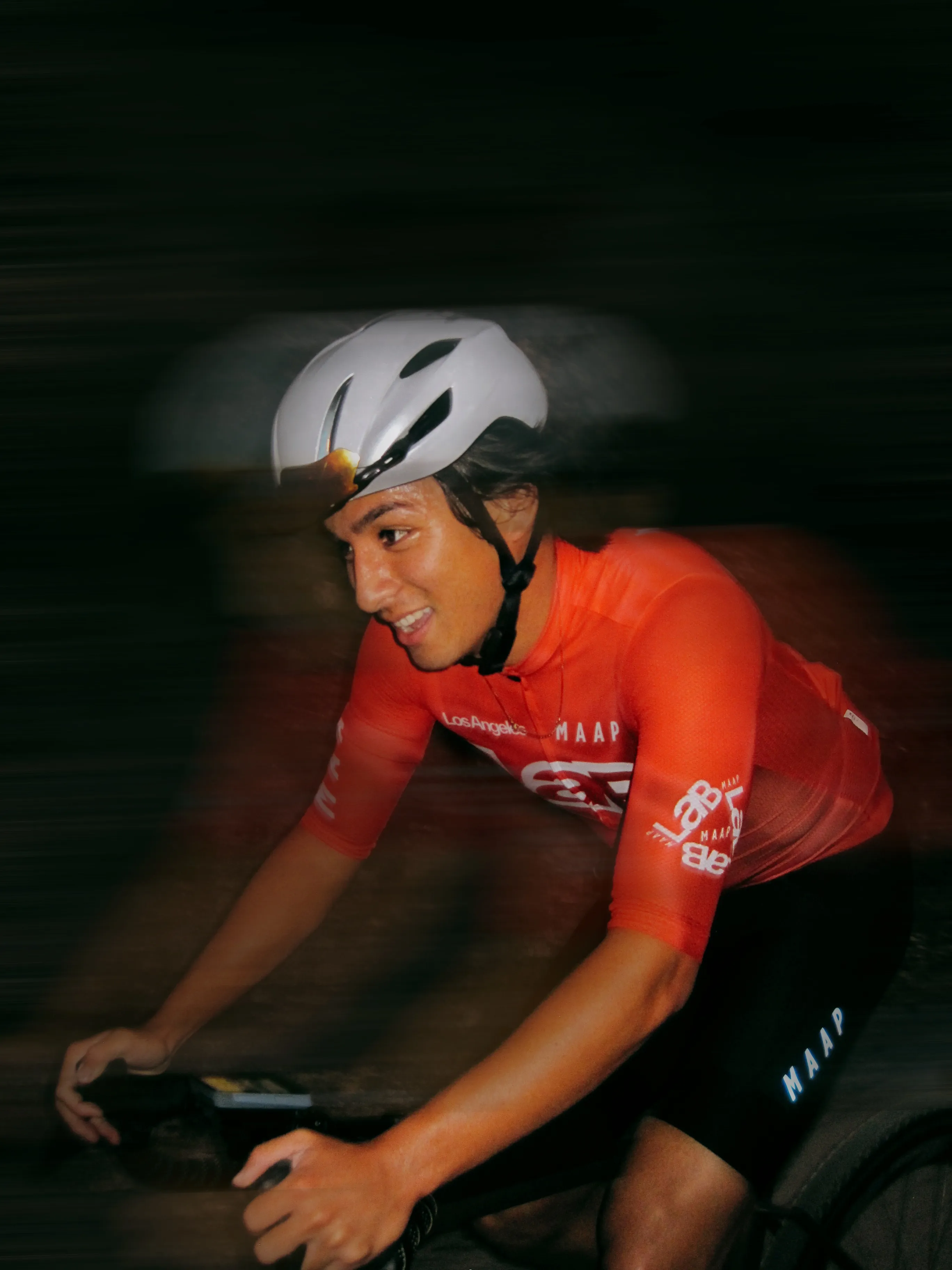 Jacob on a bike at night, in MAAP kit
