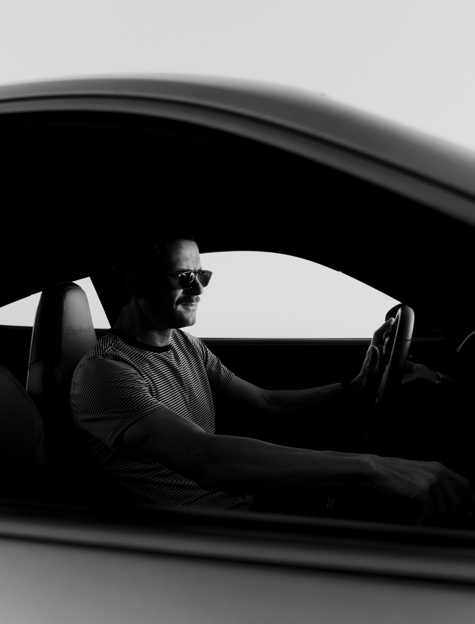 Behind the wheel.